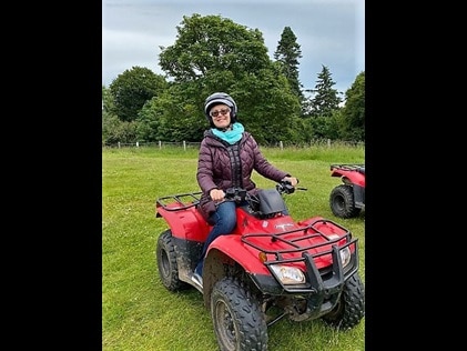 Hilton Grand Vacations Explorer riding an ATV in Dunkeld, Scotland.