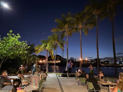 Ukulele playing at Hilton Grand Vacations' Kewalo Sunset Dinner series with Kupu, Hawaii.