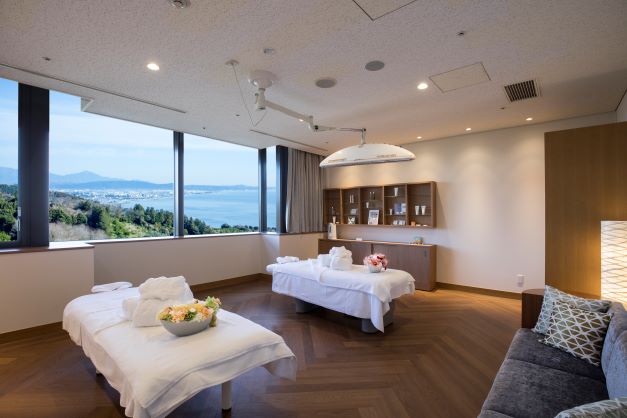Interior shot of massage room with stunning view at Spa~SEINA~, Bay Forest Odawara, a Hilton Club, Japan. 