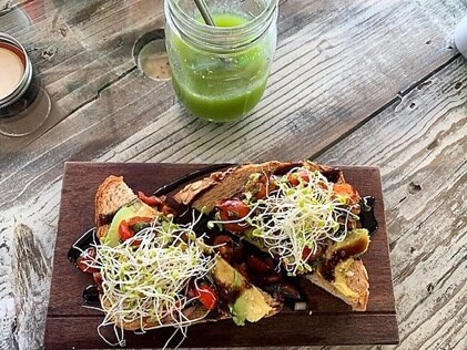 Overhead shot of healthy lunch with fresh greens and green juice. 