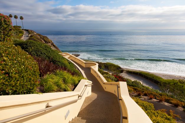 Beautiful stair walkway leading down to the beach, sunset painted skies overhead, Dana Point, California. 