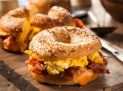 Everything bagel breakfast sandwich with egg, bacon and cheese