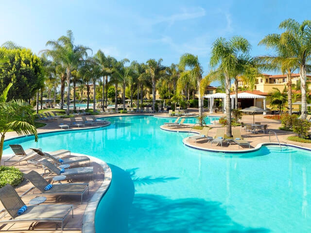 Gorgeous aerial image, bright blue pool and palm trees, MarBrisa, a Hilton Grand Vacations Club, Carlsbad, California. 